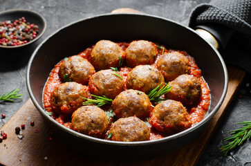 Meatballs in Tomato Sauce, Homemade Meatballs in a Pan on Dark Background