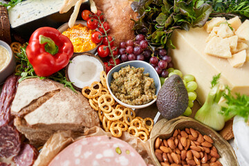 Table full of mediterranean appetizers, tapas or antipasto. Assorted Italian food set. Delicious snack on party or picnic time. Italian style banquet. 