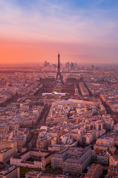 View of the Eiffel Tower and Paris skyline at sunset, France.