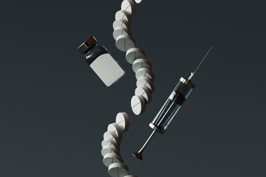 Medical injection with pills and vial against black background