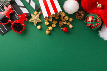 Movie debut with New Year's theme, perfect for kids. Overhead image of film clapper, gingerbread...