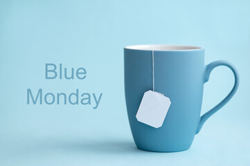 Blue Monday concept with blue cup of tea