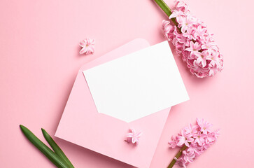 Blank greeting or invitation card mockup with envelope and flowers, white card mock up with copy space