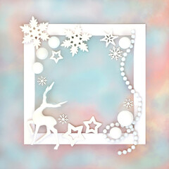 Christmas reindeer snowflake star and ball decoration on white frame on rainbow sky background. Festive abstract fantasy design north pole theme.