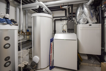 the interior of a modern boiler room - technical room with equipment of an family house with...