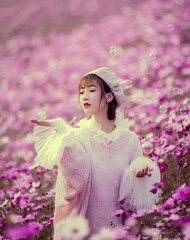  girl with flowers in the garden