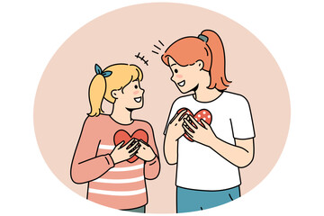 Happy girls kids holding paper heart in hands showing love and care. Smiling children with postcards demonstrate support and comfort feel grateful. Vector illustration.