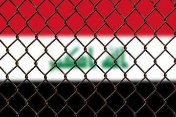 Fototapeta premium A steel mesh against the background of the flag Iraq.