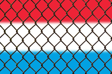 Fototapeta premium A steel mesh against the background of the flag Luxembourg.