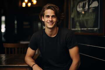 A young stylish man in a black T-shirt and. Street photo