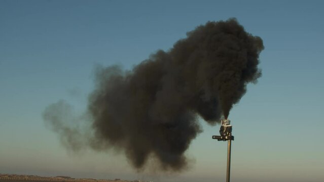 Black smoke against blue sky. 
Color space : Rec1886.Rec709 
Shot at 120fps, delivered at 60fps