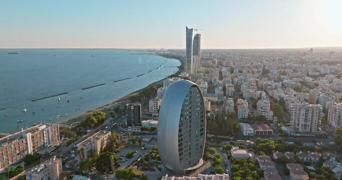 Aerial view of the cityscape of Limassol, Cyprus. The Oval building is an office building in the business center of the city. High quality 4k footage