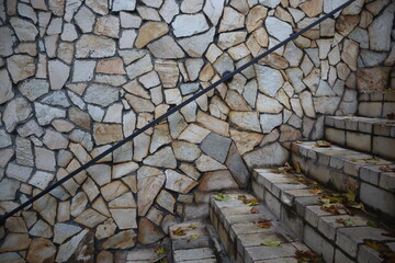  outdoor stone staircase. with stone wall background