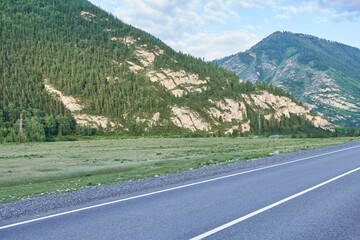 Asphalt road in the mountains. Altai, Siberia, Russia