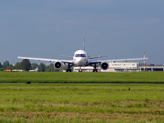 plane taxiing on the airport runway