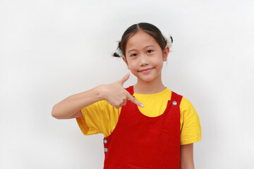 Asian girl child pointing down over white background.