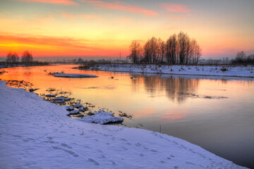 Winter landscape, amazing sundown in winter , Poland Europe, river valley Knyszyn Primeval Forest - obrazy, fototapety, plakaty