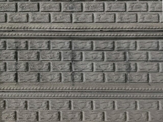 fence made of poor bricks and slabs with a texture pattern