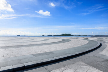 Empty square floor and coastline natural landscape under blue sky