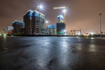 Asphalt road and construction site at night © ABCDstock