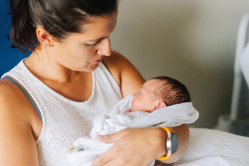 Portrait of an aunt with her one day old nephew