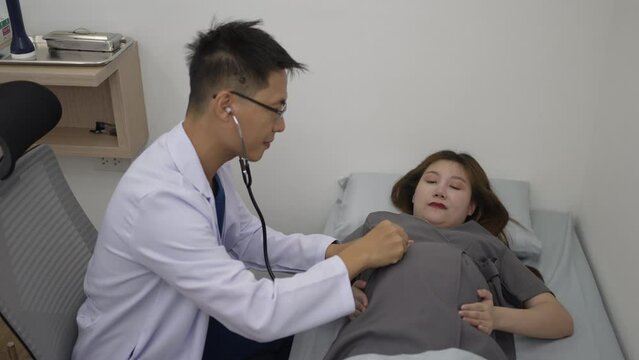Pregnant woman visit doctor for medical examination. Health care concept.