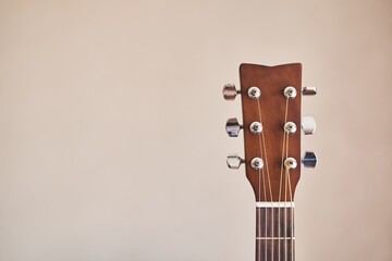 Acoustic guitar headboard with pegs. Guitar fretboard. Fretboard acoustic guitar. Close-up. Hobby