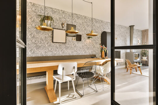 Modern dining room with pedant lights and furniture