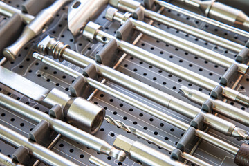 Oblique view of a set of medical tools in the toolbox before spinal surgery.