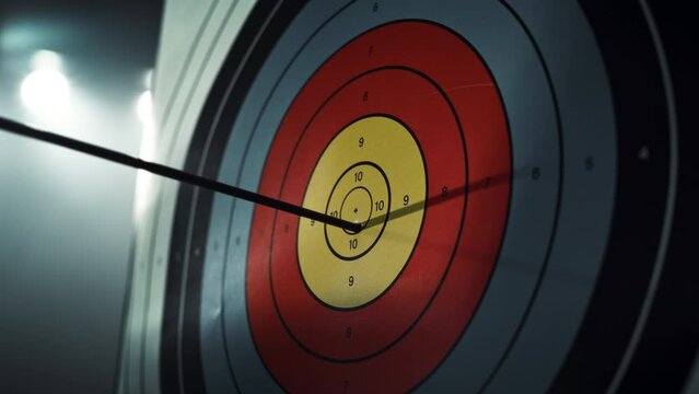 Slow Motion of an Arrow Hitting a Target. Close Up on an Arrow Hitting the Bullseye on a Colorful Board. Talented Athlete Practising for a Championship. Aesthetic Static Footage