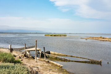 Old fishing boats stranded on the shore of the Delta del Ebro