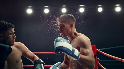 Professional Boxing Match in Super Slow Motion. Boxer Defending From a Punch and Countering with a Hook to the Jaw, Knocking Out the Opponent. Cinematic Footage with a Speed Ramp Action Effect - Powered by Adobe