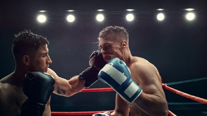 Cinematic Footage with a Speed Ramp Super Slow Motion Effect. Two Professional Boxers Fight in a Ring. Boxer Ducking to Avoiding a Hit, Punching with a Hook to the Face, Rocking the Opponent - Powered by Adobe