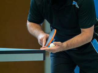Close up of a table tennis player serving