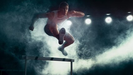 Aesthetic Dark Studio Sports Footage with Super Slow Motion Speed Ramp and Smoke Effects. Talented Male Hurdler Jumping Over Obstacle, Racing Against Time and Setting a New Sprint Record - Powered by Adobe