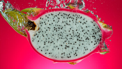 Freeze motion of falling fresh pitahaya into water
