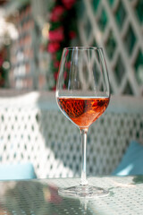 A glass of aperol on a restaurant table, summer cafe