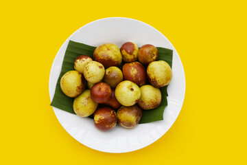Fresh jujube fruit on yellow background
