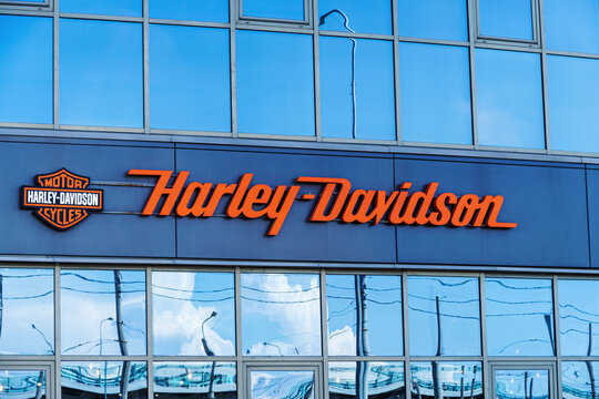Harley Davidson signboard with logo above the entrance of store  in St Petersburg