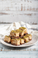 Pistachio and chocolate chip cookies. Fresh pistachio cookies on wooden background. Close up