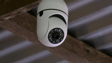 A CCTV camera installed on the street moves and monitors security