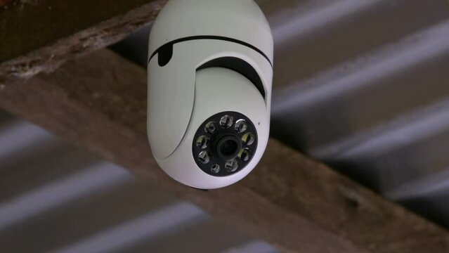 A CCTV camera installed on the street moves and monitors security