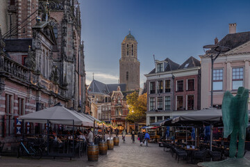 The beautiful center of the old town during nightfall in Zwolle a hanseatic city in the province of Overijssel, Netherlands - obrazy, fototapety, plakaty
