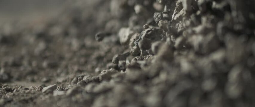 soil slowmotion moving falling and bouncing with dust and particles