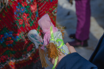 Toy straw effigies for the celebration of Maslenitsa. The doll is dressed for the burning ceremony