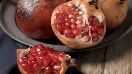 Pomegranate fruit on rustic table