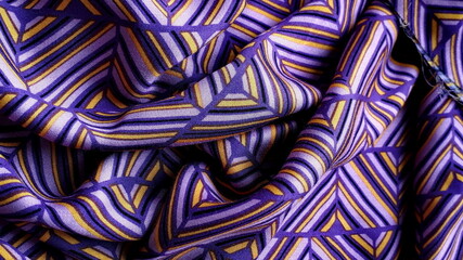 Purple cotton fabric with geometric patterns. Fabric texture. Viscose, cotton. Multi-colored bright summer fabric.