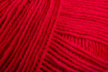 woolen threads of red color for knitting knitting close-up