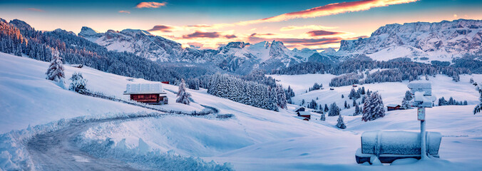 Panoramic morning view of Alpe di Siusi village. Majestic winter sunrise in Dolomite Alps. Superb landscape of ski resort, Ityaly, Europe. Beauty of nature concept background. - obrazy, fototapety, plakaty