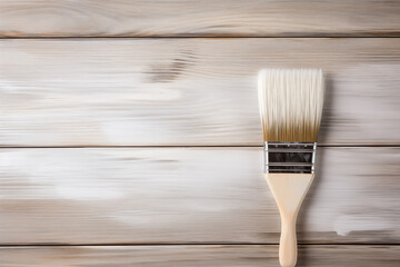 Brush with white paint is on boards. Painting of  wood board or furniture. space for text